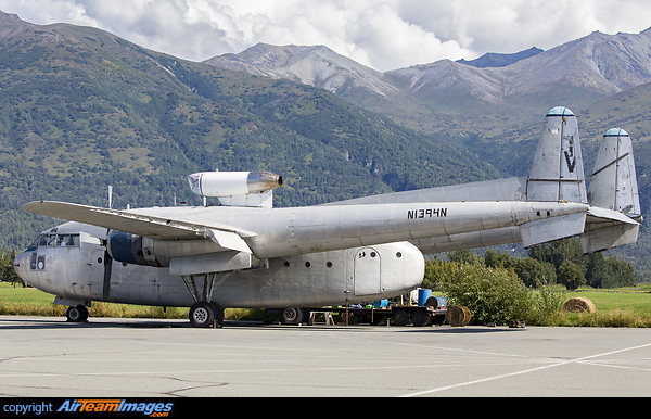 Resting in the sun at Palmer Alaska a C-119 interestingly with the jet assist engine on the cabin roof to assist with high gross weight take offs. Fairchild C-119F Flying Boxcar