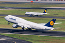 Rotating from runway 07C, in the background is A321-100 D-AIRR on taxi...
