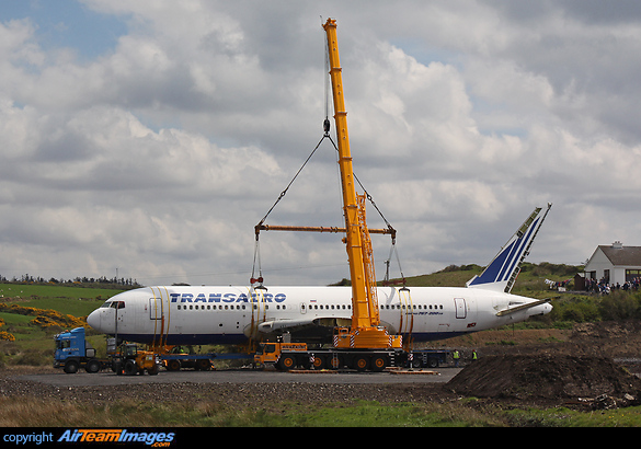 This Boeing 767 was removed from Shannon Airport and floated round the coast by barge to Enniscrone, County Sligo. It is seen at the end of its journey being lifted from a flatbed and swung into position. It will now be converted into a hotel. Boeing 767-216/ER