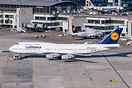During push-back. In the background is A320neo D-AINB parked at the te...