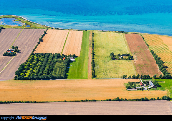 Overview of the airfield, with the green grass strip right of the forest area being runway 29. Endelave Airfield
