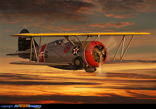 Grumman F3F-2 US Navy biplane in a spectacular evening sky. Grumman F3F-2