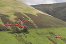 The Red Arrows seen here flying Low Level between the mountains of Cum...