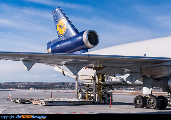 On the cargo ramp after a charter flight full of cars for winter testing, ready for unloading. McDonnell Douglas MD-11F