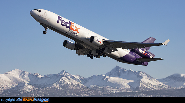 Soaring above the Chugach Range to the east of Anchorage a Fedex MD-11 blasts off headed to Memphis. McDonnell Douglas MD-11F