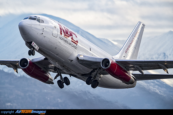 A Northern Air Cargo 737-200 roars out of Anchorage from runway 33 with the Chugach range as a backdrop. Boeing 737-232/Adv(F)