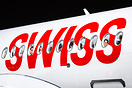 Swiss characters on the fuselage of the aircraft with passengers in th...