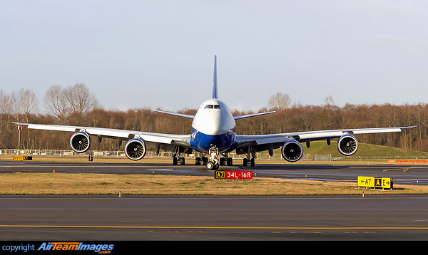 Silkway West Airlines 747-8 freighter head-on at the golden hour lit by golden warm light Boeing 747-83QF