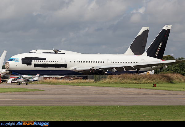 In the scrapping compound for this ex-British Airways 767 along with a company 747-400 G-BNLW just behind. Boeing 767-336/ER