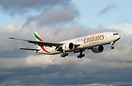 Emirates latest Boeing 777-300ER on final approach in warm golden ligh...