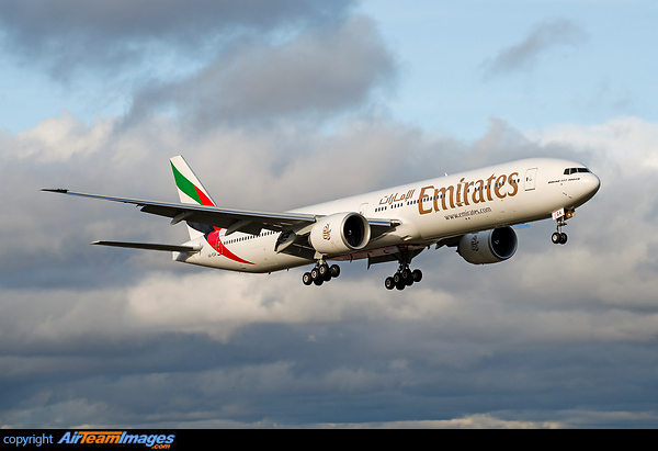 Emirates latest Boeing 777-300ER on final approach in warm golden light just before sunset Boeing 777-31H/ER