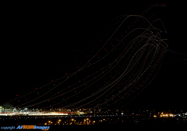 Heathrow night take-offs on runway 27R, starting at 22:01:46 until 22:47:23. This image is the result of 17 photos stacked, which account for 22.35 minutes of aggregate exposure, with an average of 1.4m exposure per photo. The long red blinks are 787s, there 3 in this image. London Heathrow Departures