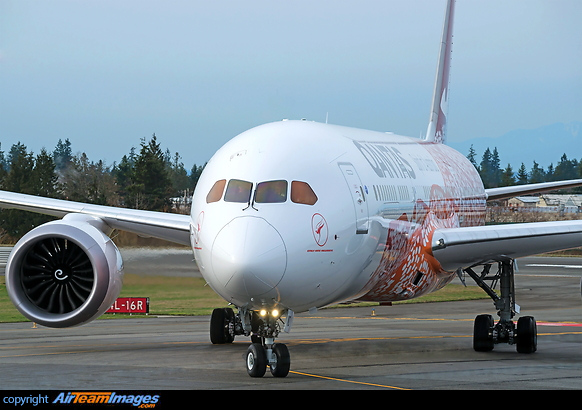 Head on closeup shot of the colorful Qantas airplane named "Emily Kame Kngwarreye" Boeing 787-9 Dreamliner