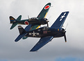 Two aircraft of the Commemorative Air Force participating in a mock do...