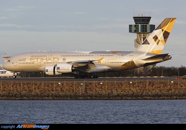 The setting sun accentuates the golden sheen in Etihad's stunning livery. Etihad's A380 is seen here rolling past Sydney's iconic control tower after landing on runway 34L. Airbus A380-861