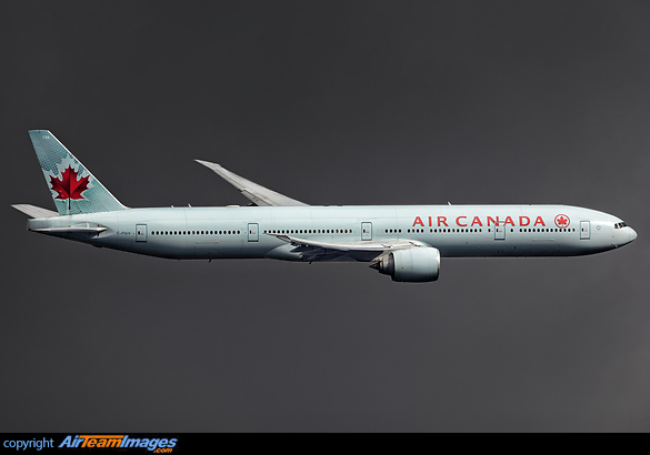 Banking away from runway 09R Boeing 777-333/ER