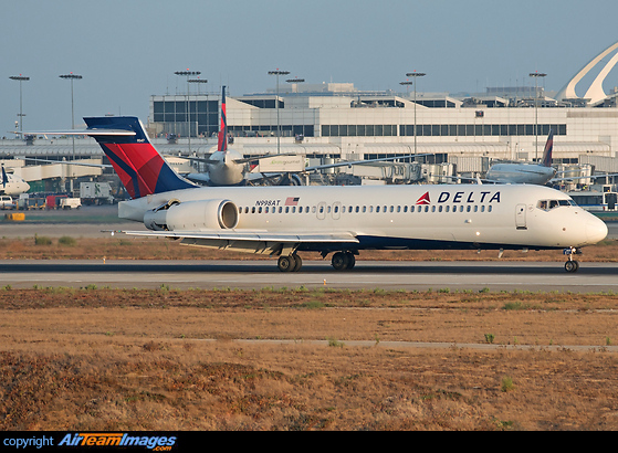 Engine thrust reversors opening up after touchdown at the golden hour Boeing 717-2BD