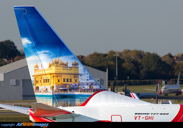 Air India Express' latest 737-800, VT-GHI, passed through Birmingham on delivery, night-stopping for crew rest. The starboard side of the tail depicts the Golden Temple of Amritsar. Boeing 737-86N