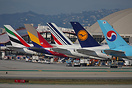 A line of 5 Airbus A380 aircraft at the international terminal, LAX.