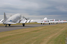 A line up of DC-3's taxi out for departure as part of the D-Day 75th a...