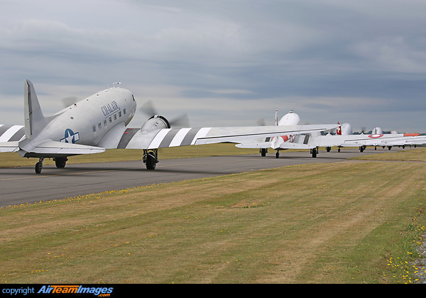A line up of DC-3's taxi out for departure as part of the D-Day 75th anniversary commemoration. Douglas C-47B Skytrain (DC-3)