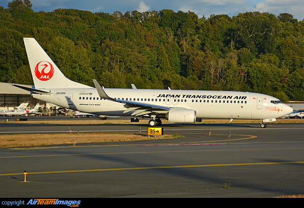 Japan Transocean Air taxing down in warm golden sunset light Boeing 737-8Q3