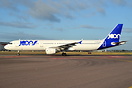 Holding short of runway 27 left before taxying to stand in Terminal 4.