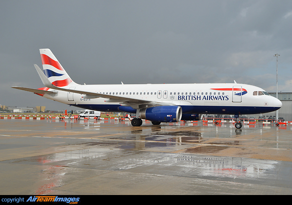 Heading for departure after a recent downpour. Airbus A320-232