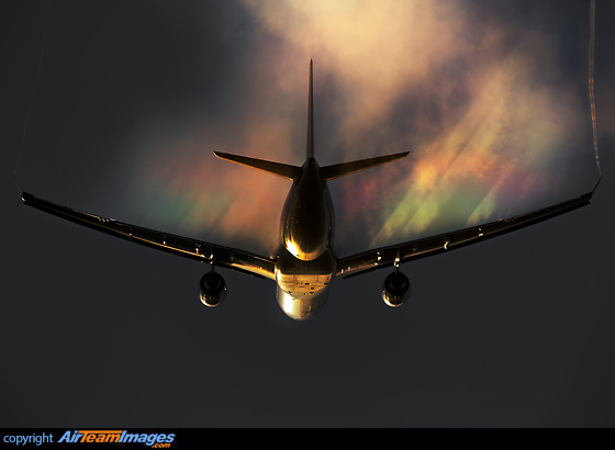 Creating her own weather system with sunshine lit condensation over the wings forming rainbows Airbus A330-202
