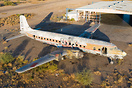 A classic airliner slowly rotting in the desert but now with graffiti....