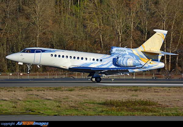 colorful livery Falcon 7X right on touchdown during a golden autumn/ fall sunset sun Dassault Falcon 7X