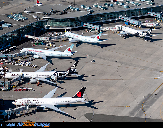 Parked Air Canada 777s in storage with Air New Zealand 777s operating repatriation flights to Germany. Vancouver Airport