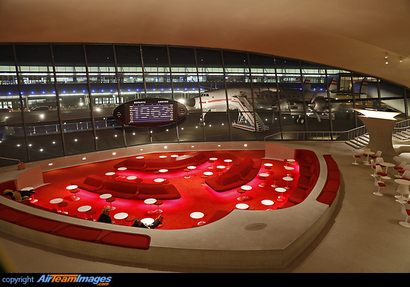The lounge of the TWA hotel in JFK with the iconic Lockheed Starliner in the background. New York JFK - TWA Hotel