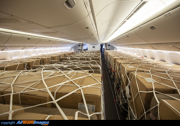 Thousands of masks and gloves are loaded onto passenger seats Boeing 777-3DE/ER