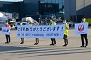 ANA and JAL staff united holding a message We can get through, togeth...