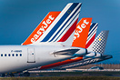 Lineup of tails from various liveries including Easyjet, Air France an...