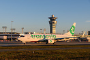 Transavia France Boeing 737 taxiing in the golden morning light passin...