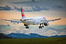 Swiss A321 landing with the Alps in the background