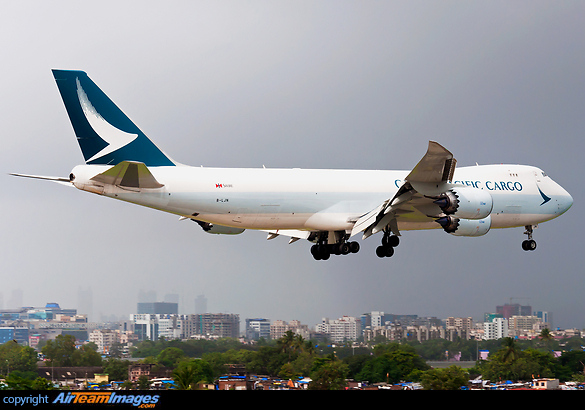 Cathay Pacific Cargo's long freighter shiny and donning the new colours on final for R27 under contrasting weather conditions at VABB. B747-8F, B-LJN. Boeing 747-867F
