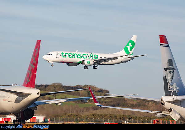 Transavia France Boeing 737-800 returning to Shannon following a test flight. The aircraft will take on a French registration following delivery. Also partially featured are an Omni Air International Boeing 777 and a Norwegian Boeing 737 in the foreground. Boeing 737-86J