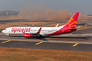 As Spicejet's B738 holds short of R27, in the backdrop, a technically ...