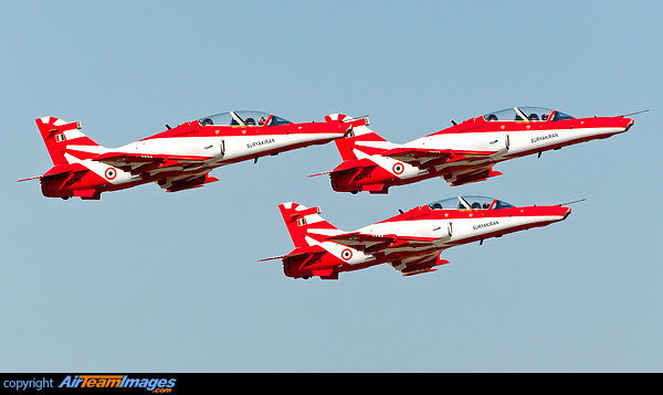 In May 1996, Wg. Cdr. Kuldeep Malik, and his team was given the task to form a formation aerobatic team. The team has since performed numerous demonstrations in various parts of the country and abroad, and was amongst the renowned nine-aircraft public display aerobatic teams in the world. The squadron was primarily composed of the HAL HJT-16 Kiran Mk.2 military trainer aircraft and are based at the Bidar Air Force Station in Karnataka and now are equipped with British Aerospace Hawk Mk.132s. The SuryaKirans are from the No. 52 Squadrons "The Sharks" with the motto of "Sadaiva Sarvottama" i.e. "Always the Best." Seen here are the first 3 Indian Air Force, SuryaKirans, British Aerospace Hawk Mk. 132, A3702, A3701 and A3670 rocketing out off R09 at Hindon AFB. Surya Kiran Aerobatic Team