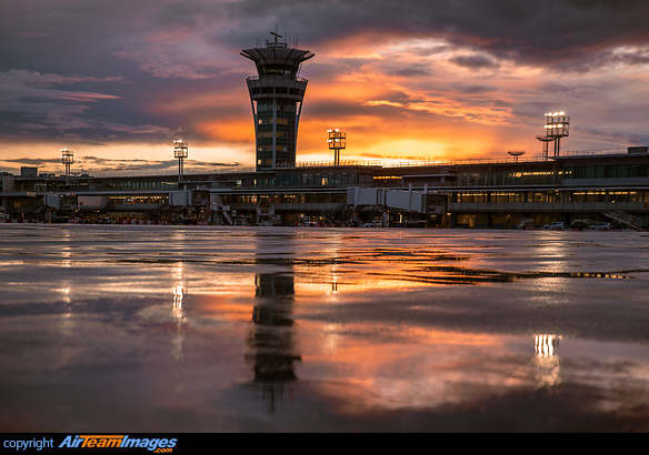 Paris Orly ATC Tower reflecting on apron after heavy sunset showers Paris Orly Airport