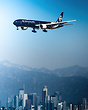 Short final for LAX past the city skyline