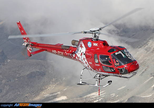 Hauling construction materials to Gornergrat, Swiss Alps, at high altitude. Aerospatiale AS-350B3 Ecureuil