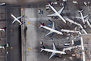 Various Delta aircraft sitting at the gate and taxiing at LAX.