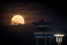 August's full Moon rising behind Paris Orly airport's ATC Tower