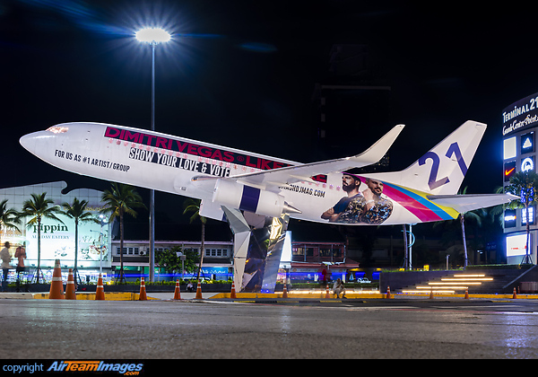 Boeing 737-300 ex Orient Thai Airlines on dispay at downtown Pattaya in front of Terminal 21 shopping mall with temporary Dimitri Vegas & Like Mike advertisement Boeing 737-3T0
