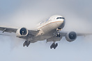 United Boeing 777-200 creating condensation over the wing during final...