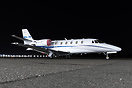 Cessna Citation XLS+ sitting at Livermore Municipal Airport at night.